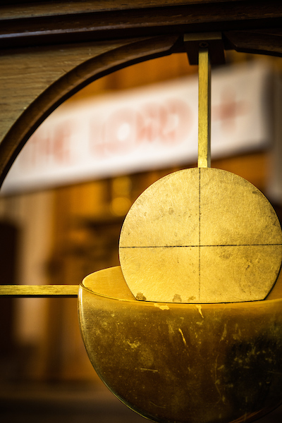 Decorative metalwork of the bread and body of Jesus Christ adorns the altar rail at Gethsemane Lutheran Church on Tuesday, July 28, 2020, in St. Louis.  LCMS Communications/Erik M. Lunsford